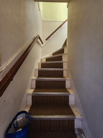 a view of a livingroom with furniture and a flat screen tv