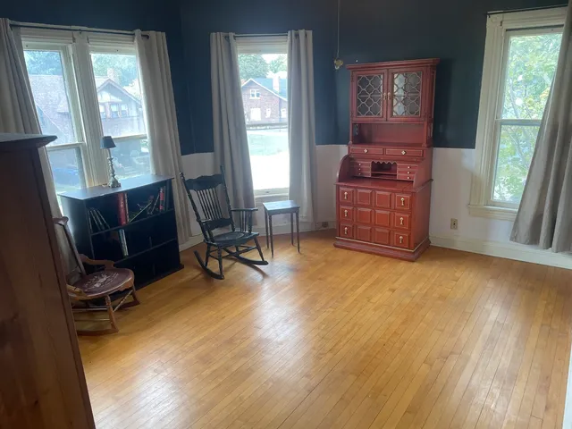 a bathroom with a toilet sink shower and mirror