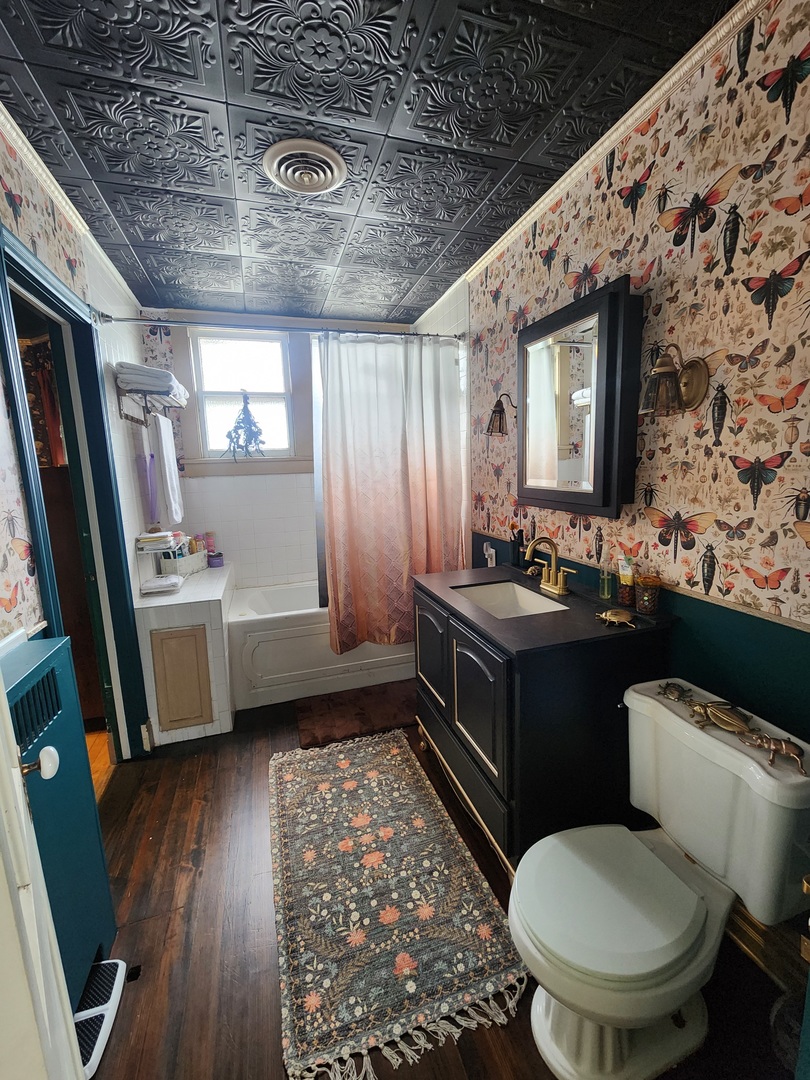 801 7th Street LaSalle, IL 61301 - Photo 41 of 50 a bathroom with a sink toilet vanity and tub