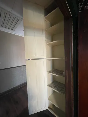 a room that has a lot of small cabinets