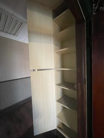 a room that has a lot of small cabinets