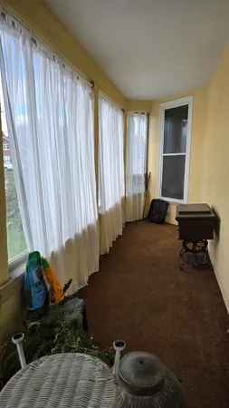 a living room with a couch and a window
