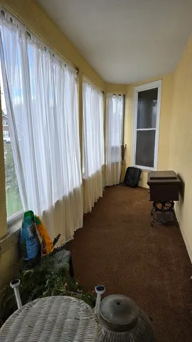 a living room with a couch and a window