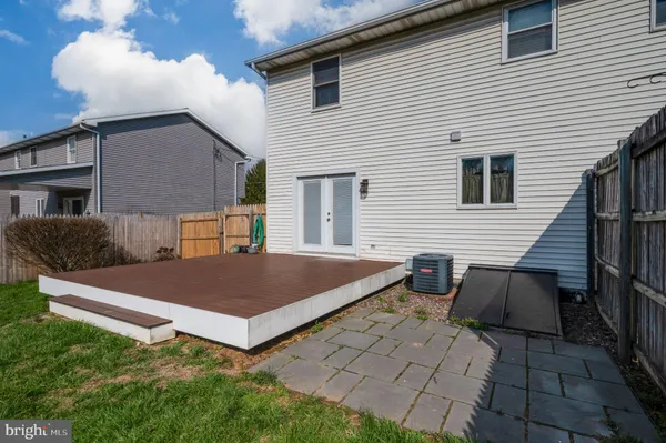 a front view of house with yard outdoor seating and barbeque oven