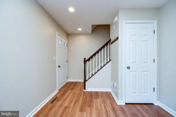 a view of entryway with wooden floor