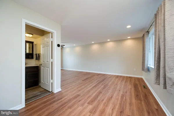a view of hallway with a wooden floor