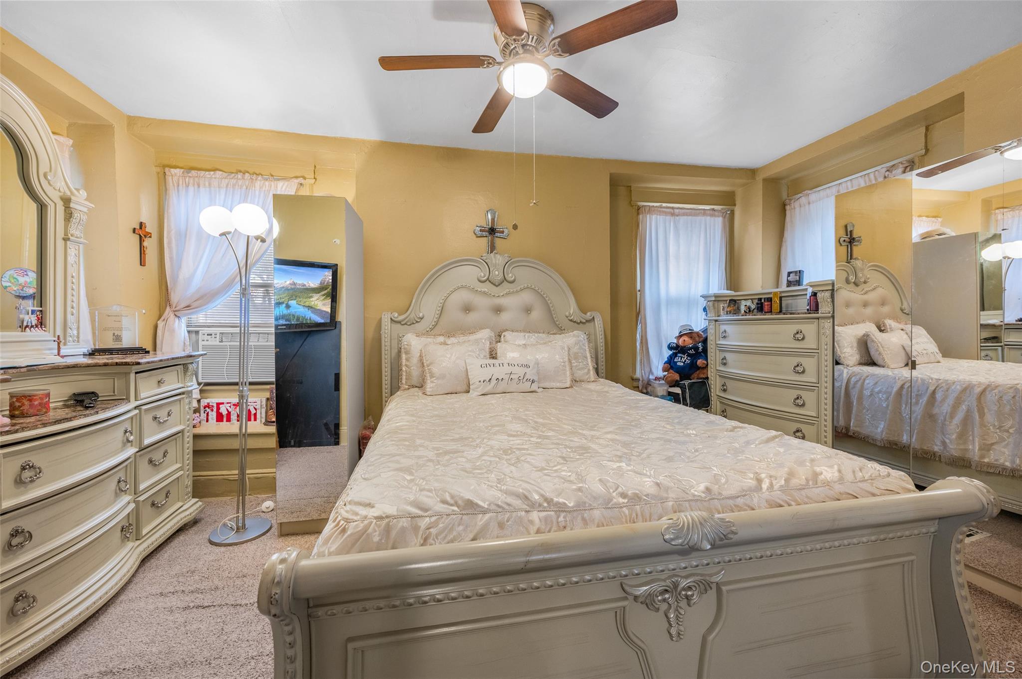 107-15 Lefferts Boulevard Queens, NY 11419 - Photo 7 of 10 a bedroom with a bed and wooden floor