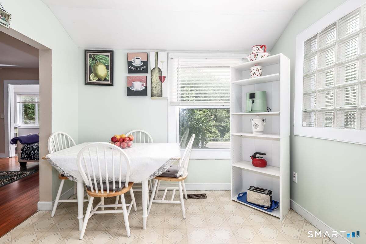 70 Dodgingtown Road Bethel, CT 06801 - Photo 9 of 27 a dining room with a window and furniture