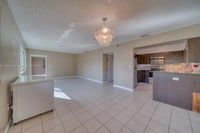 a view of a kitchen with a sink cabinets and window