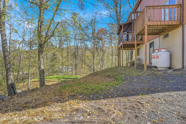 a kitchen with stainless steel appliances white cabinets and a stove top oven