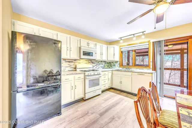 a view of a room with large windows