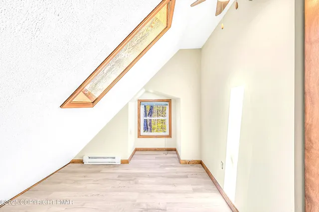 a view of a field with trees in background