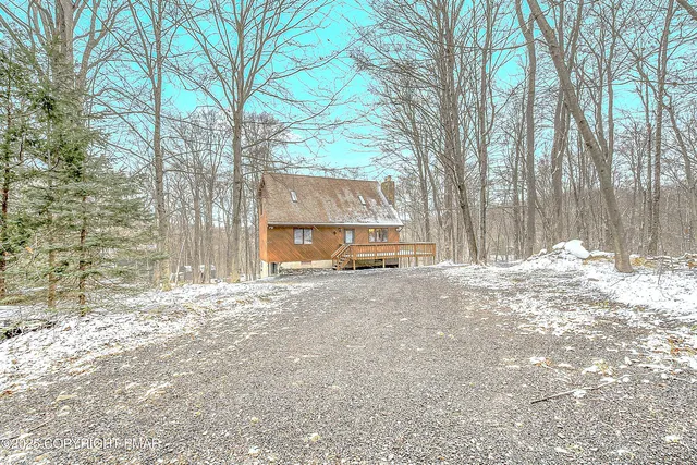 a house with trees in front of it