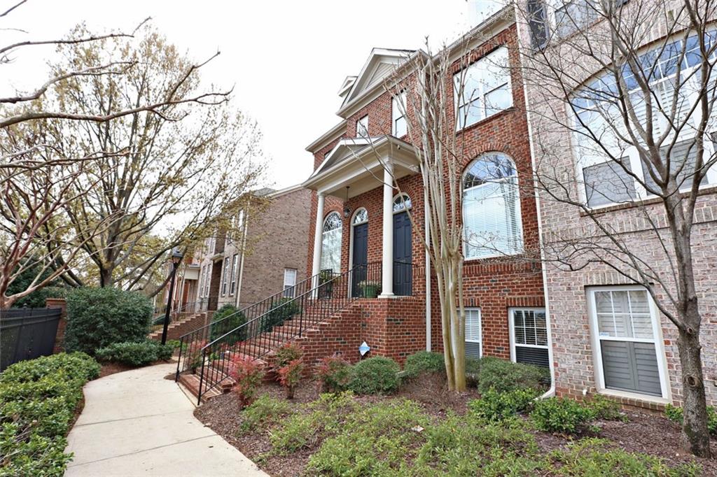 1165 Providence Place Decatur, GA 30033 - Photo 1 of 1 a front view of a house with yard and trees around