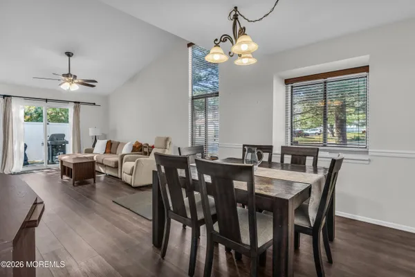 a view of a dining room with furniture window and wooden floor