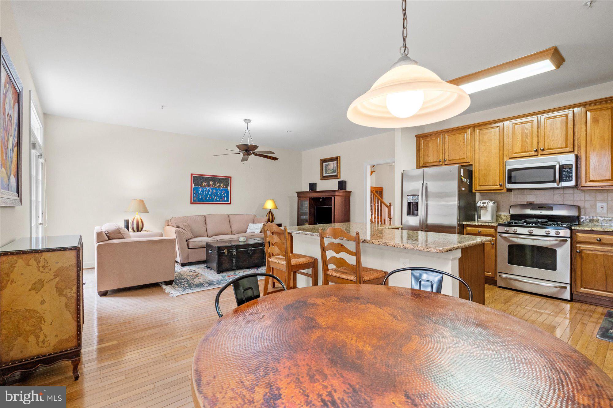 8510 Bells Ridge Terrace Potomac, MD 20854 - Photo 14 of 42 a large white kitchen with stainless steel appliances