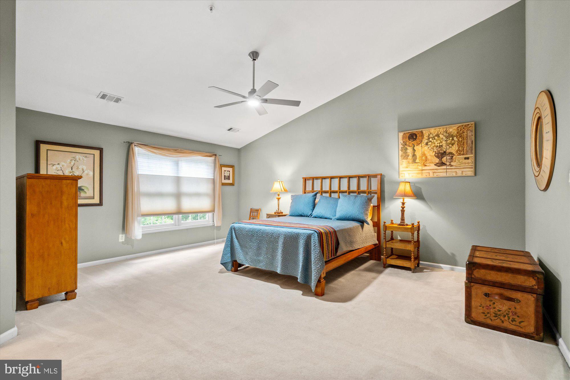8510 Bells Ridge Terrace Potomac, MD 20854 - Photo 16 of 42 a spacious bedroom with a bed and a cabinets
