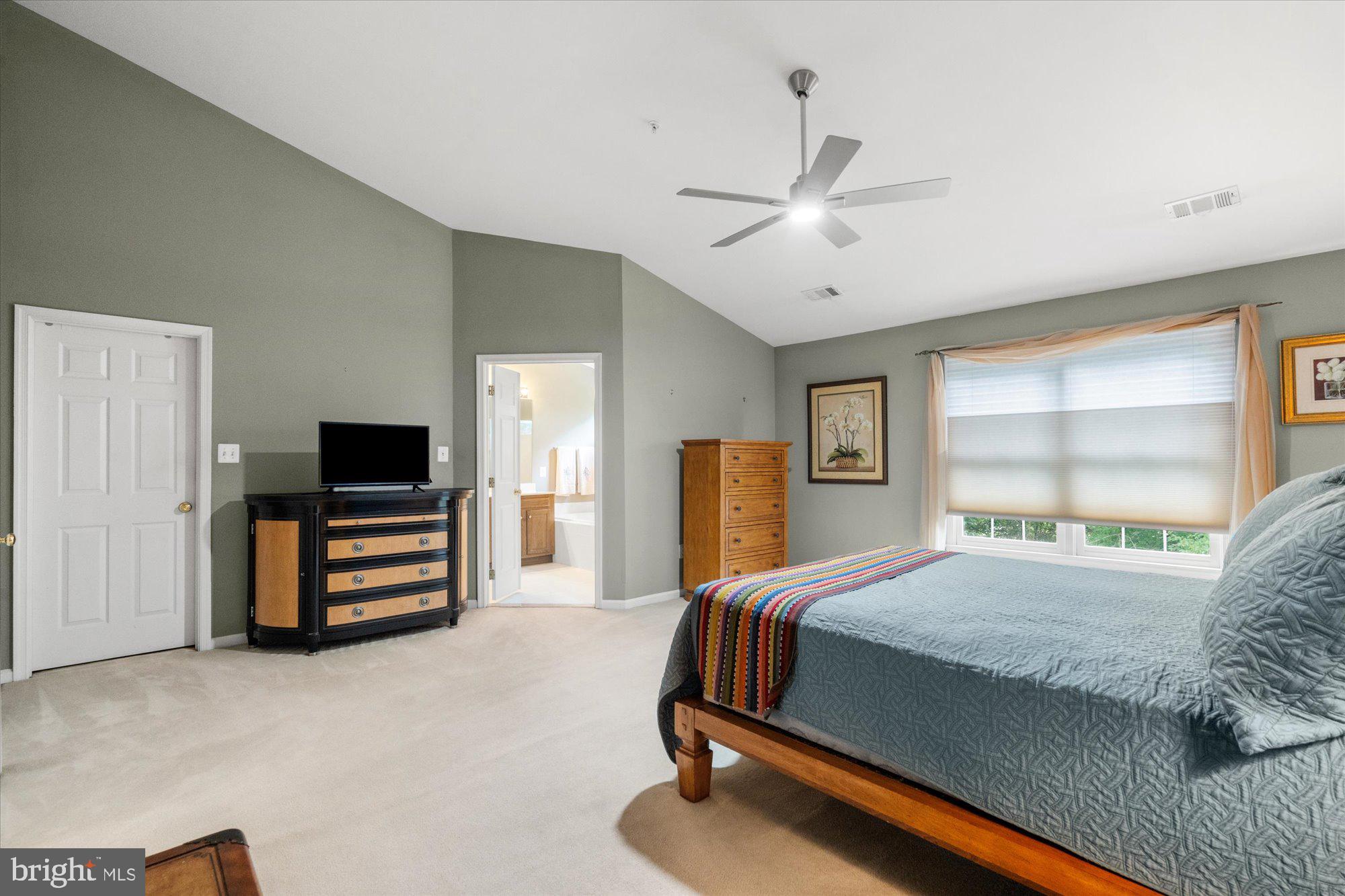 8510 Bells Ridge Terrace Potomac, MD 20854 - Photo 18 of 42 a bedroom with a bed and a television