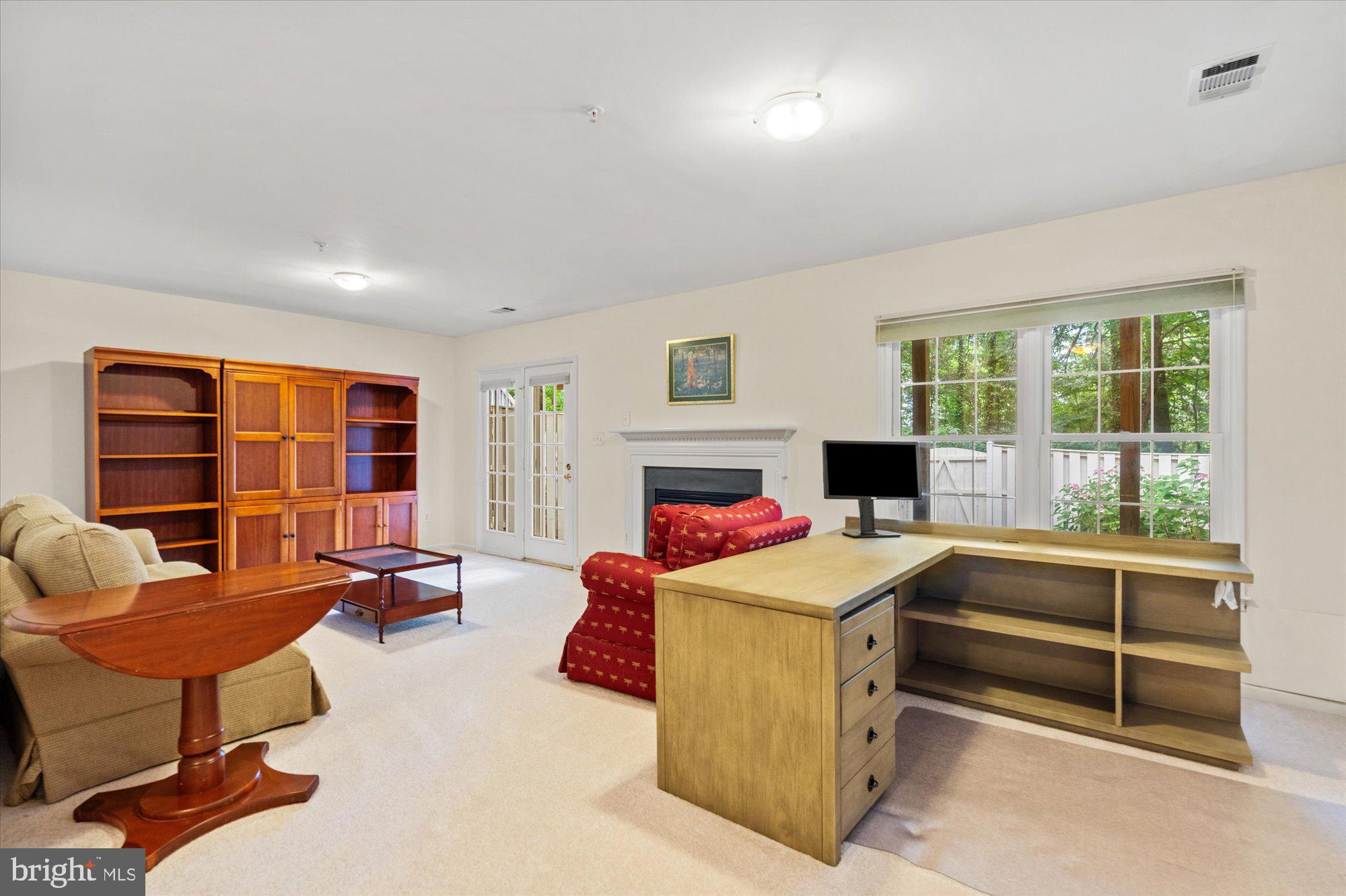 8510 Bells Ridge Terrace Potomac, MD 20854 - Photo 26 of 42 a living room with furniture and a fireplace