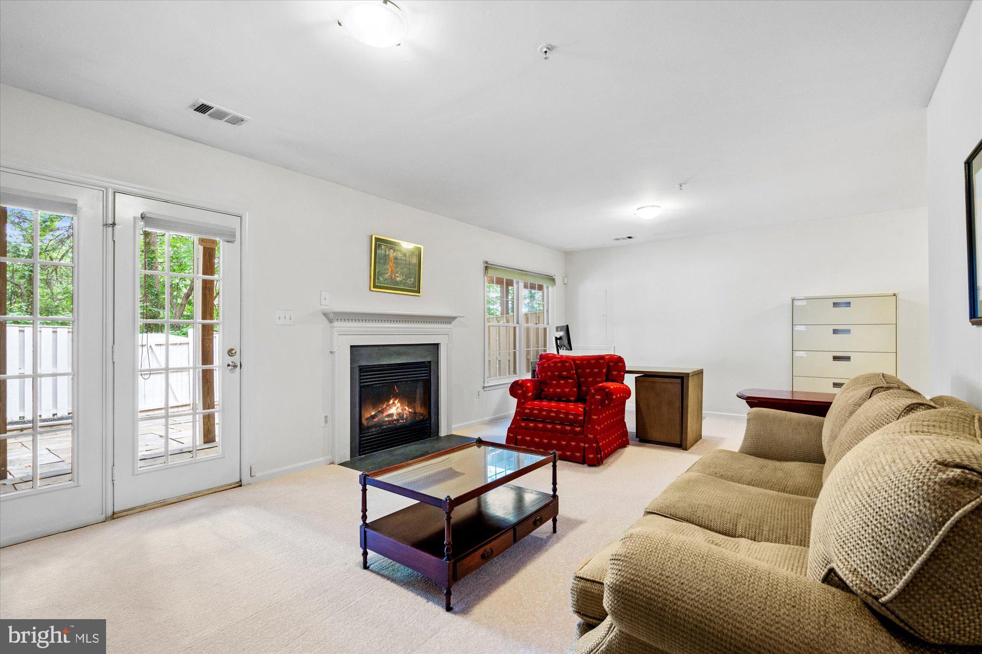8510 Bells Ridge Terrace Potomac, MD 20854 - Photo 28 of 42 a living room with furniture a fireplace