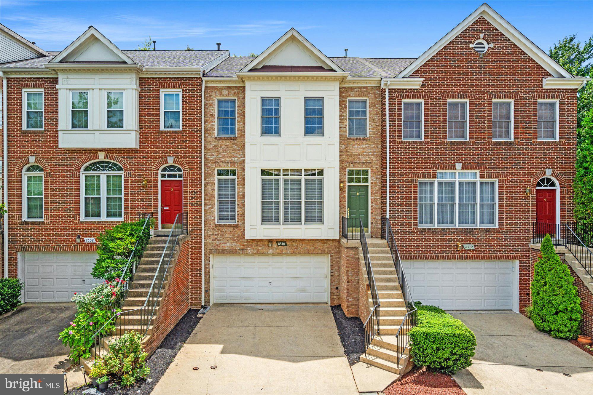 8510 Bells Ridge Terrace Potomac, MD 20854 - Photo 41 of 42 a front view of a house with garden