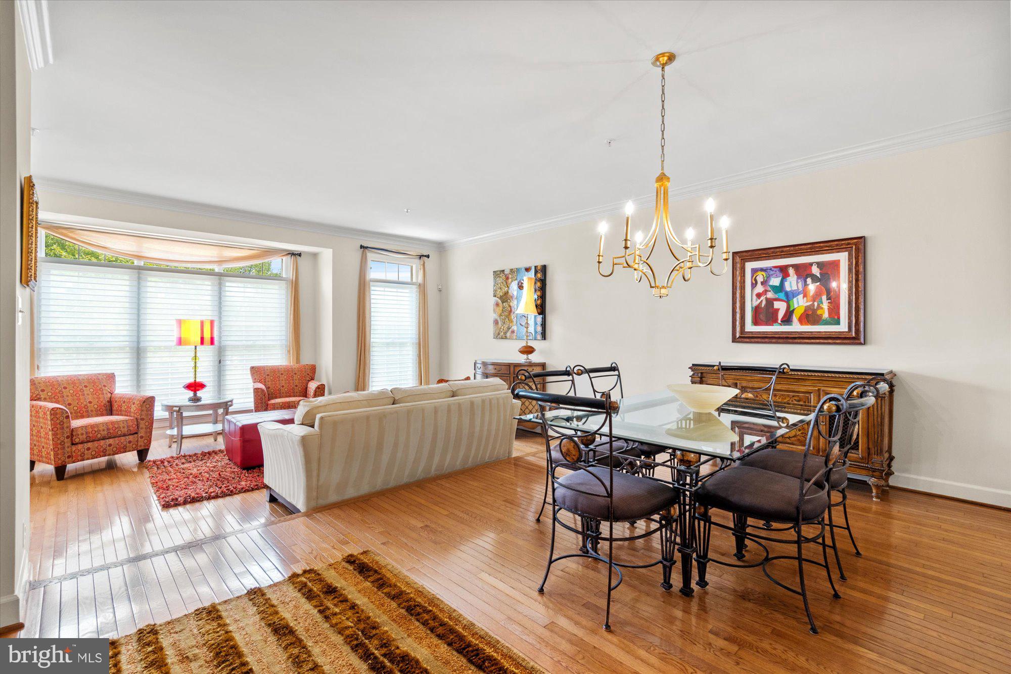 8510 Bells Ridge Terrace Potomac, MD 20854 - Photo 5 of 42 a living room with furniture and a chandelier