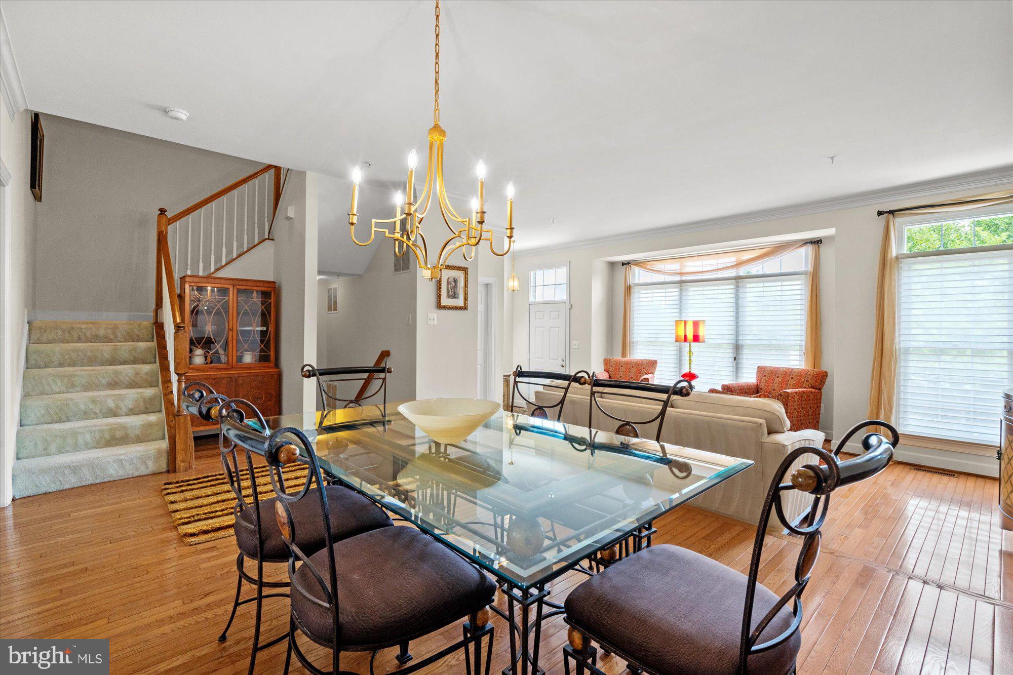 8510 Bells Ridge Terrace Potomac, MD 20854 - Photo 6 of 42 a view of a dining room with furniture and wooden floor