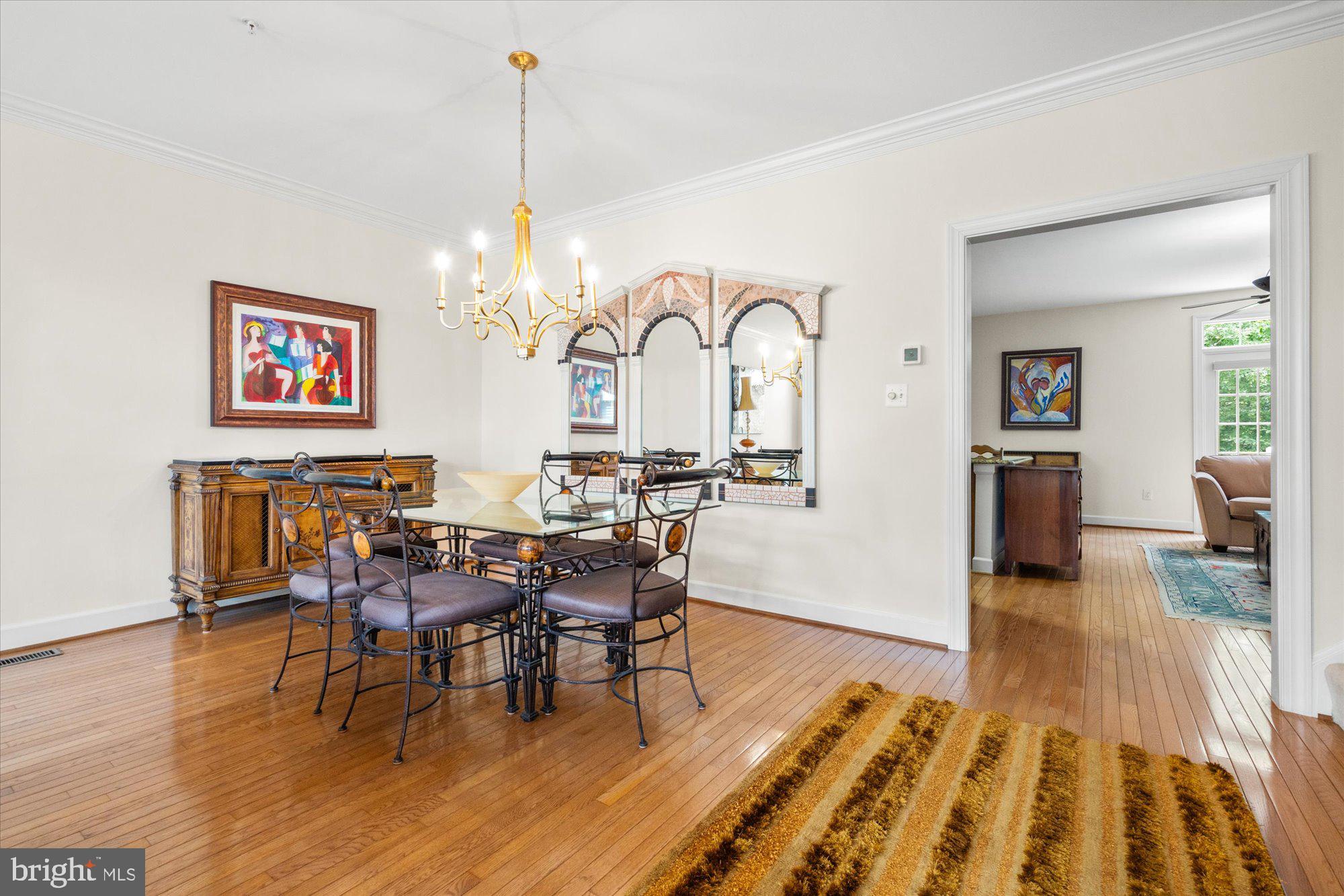 8510 Bells Ridge Terrace Potomac, MD 20854 - Photo 7 of 42 a view of a dining room with furniture window and wooden floor