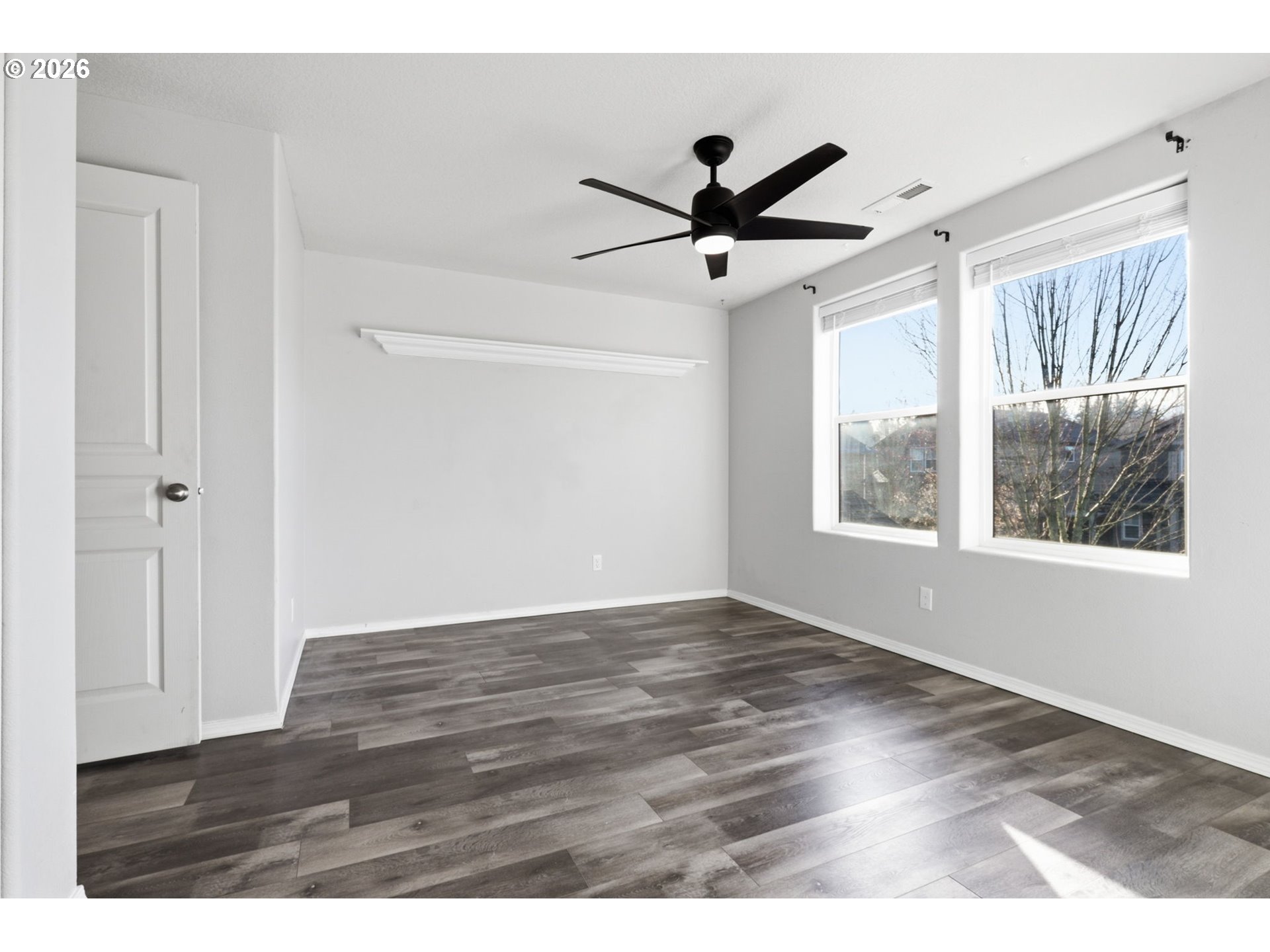 36713 Indian Summer Street Sandy, OR 97055 - Photo 20 of 33 a view of an empty room with wooden floor and a window