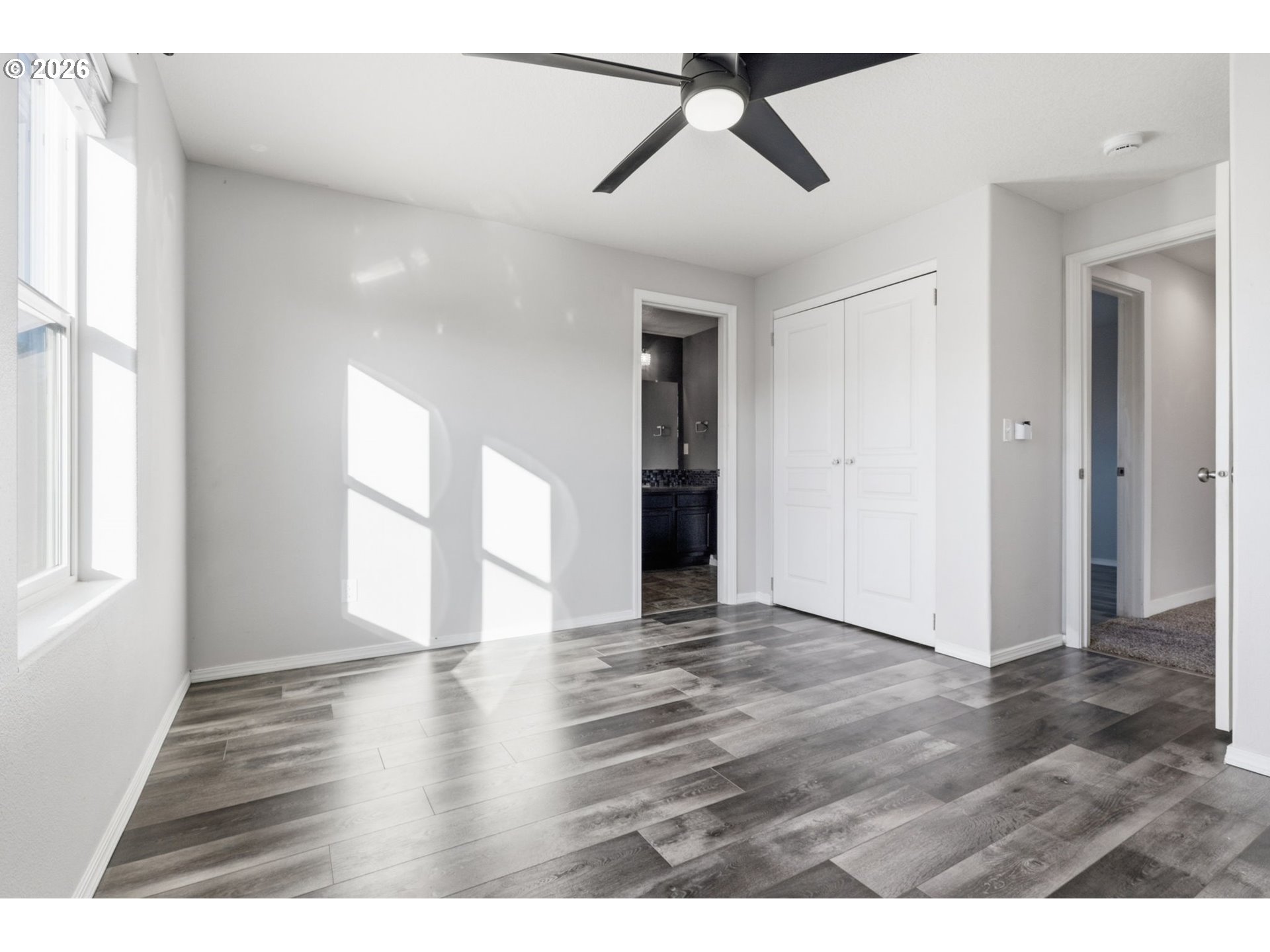 36713 Indian Summer Street Sandy, OR 97055 - Photo 21 of 33 a view of an empty room with window and wooden floor