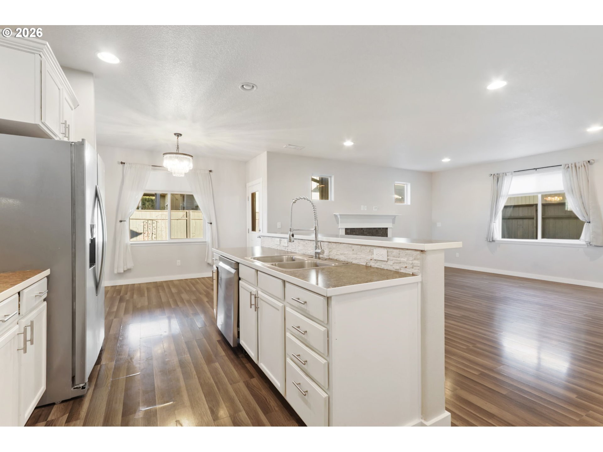 36713 Indian Summer Street Sandy, OR 97055 - Photo 6 of 33 a kitchen with a sink and wooden floor