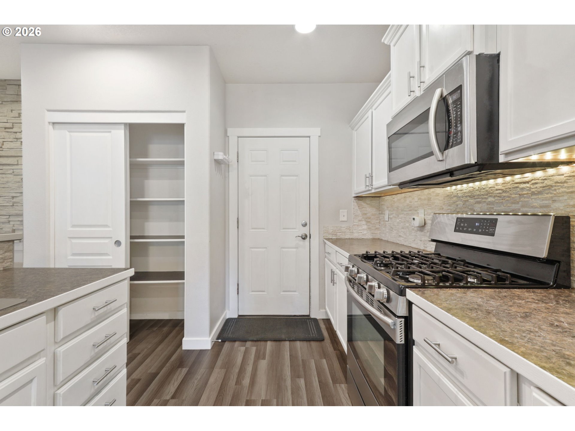 36713 Indian Summer Street Sandy, OR 97055 - Photo 8 of 33 a kitchen with stainless steel appliances granite countertop a stove and a microwave