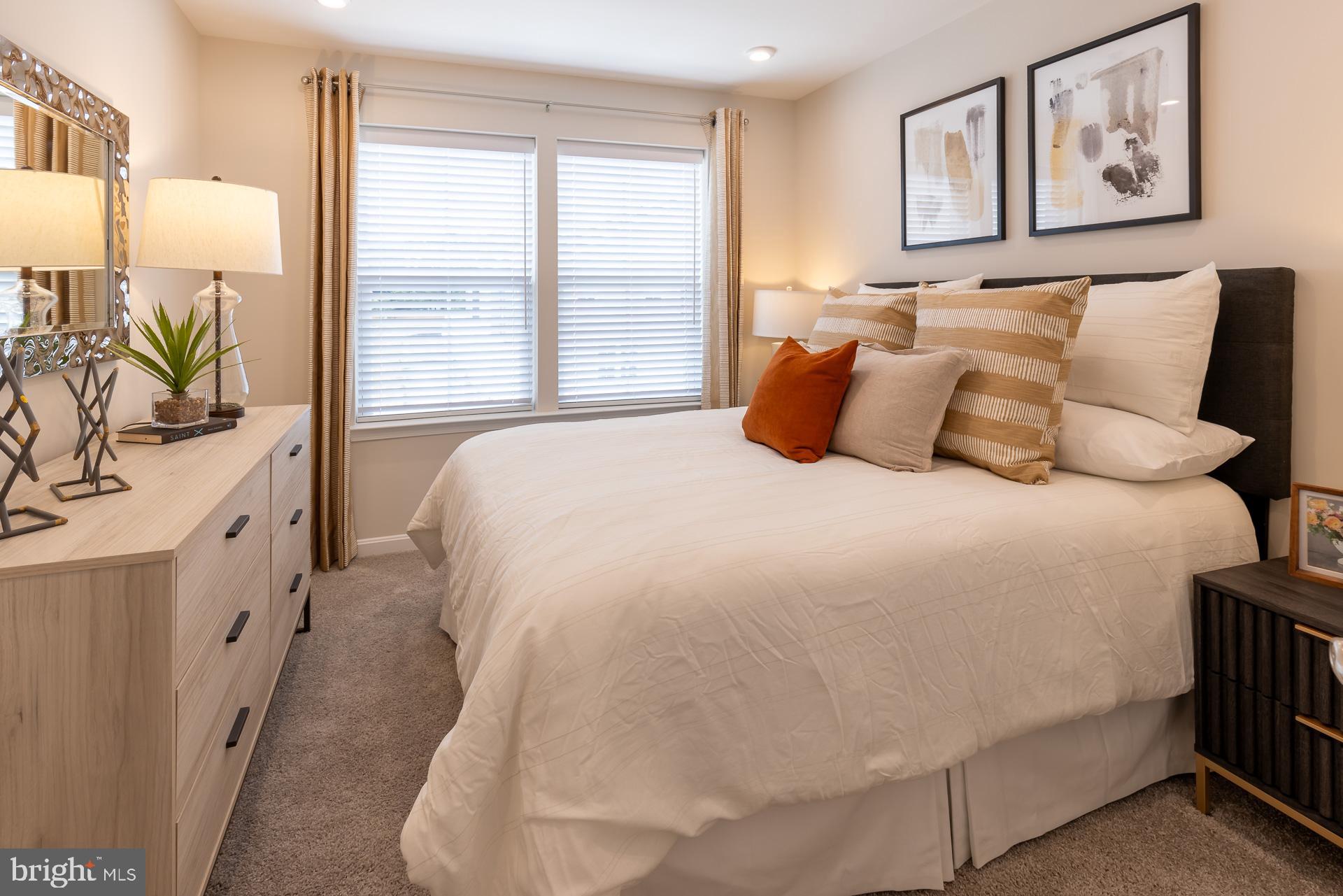 8270 Longford Road Glen Burnie, MD 21061 - Photo 8 of 11 a large white bed in a white room