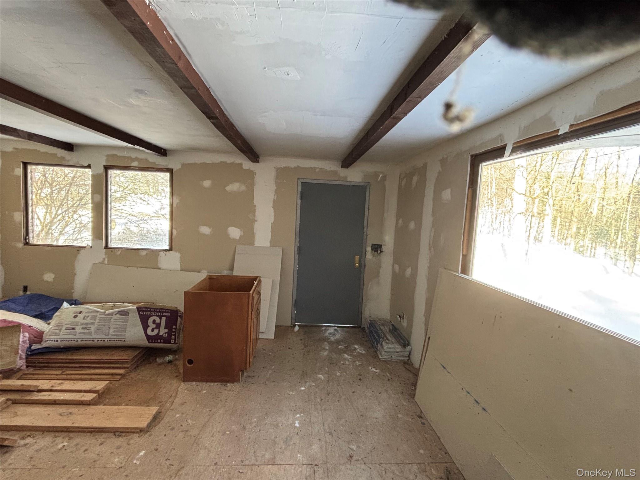 95 Skinner Road Wurtsboro, NY 12790 - Photo 29 of 49 a living room with furniture and a large window