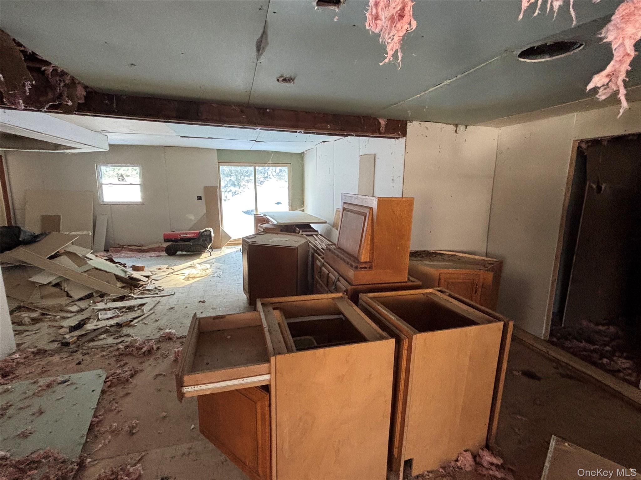 95 Skinner Road Wurtsboro, NY 12790 - Photo 33 of 49 a living room with furniture a flat screen tv and a window