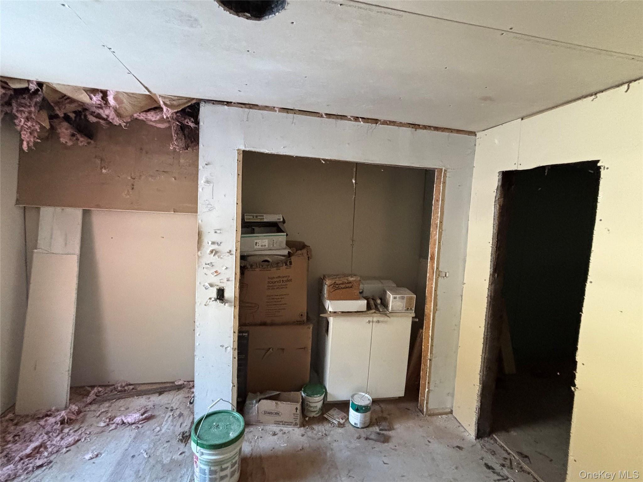 95 Skinner Road Wurtsboro, NY 12790 - Photo 37 of 49 a room with a refrigerator and a wooden floor