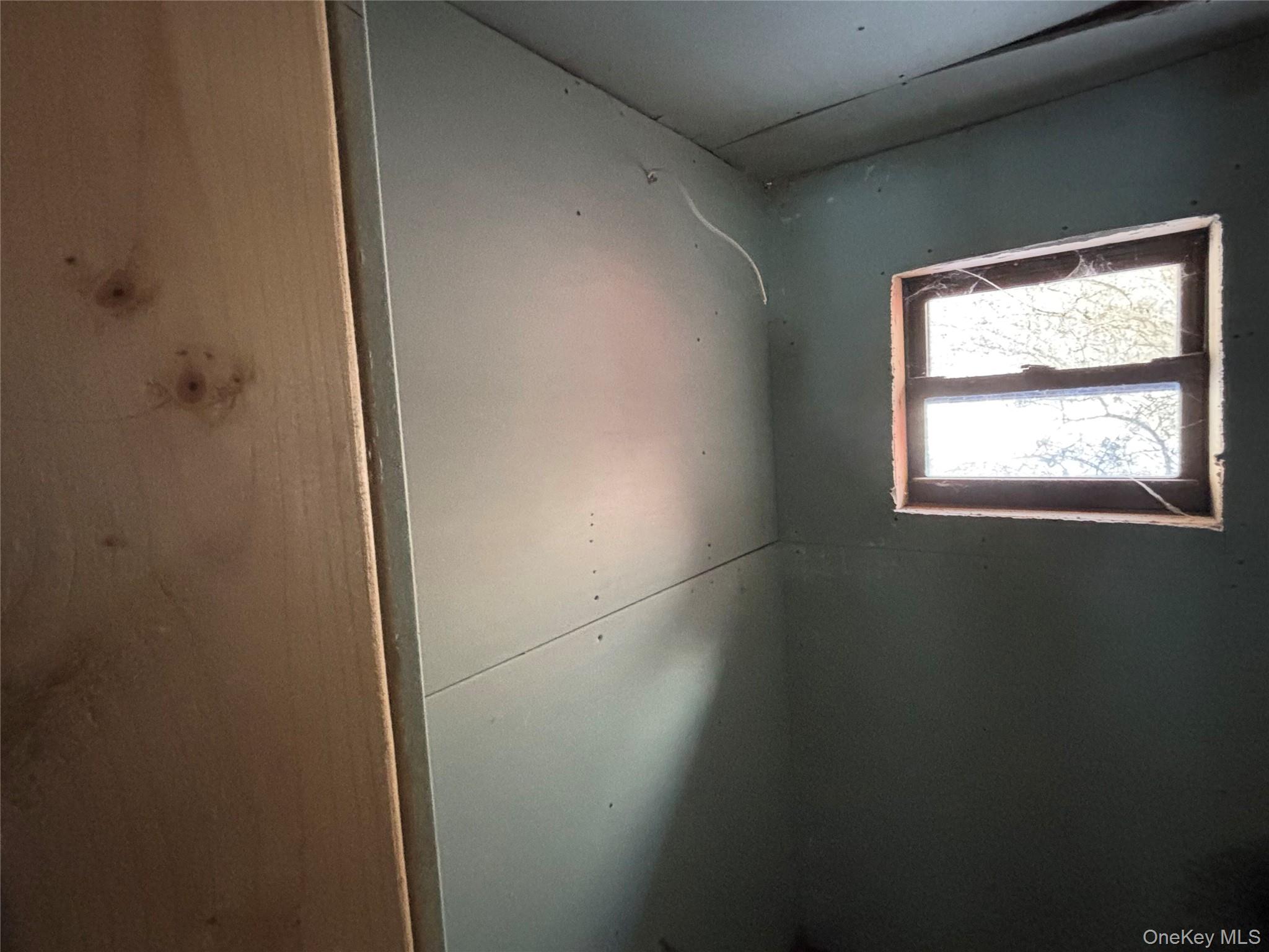 95 Skinner Road Wurtsboro, NY 12790 - Photo 45 of 49 an empty room with a window