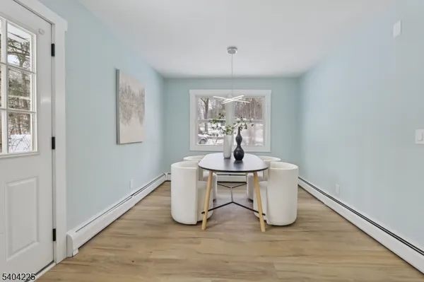 a view of a livingroom with a dinning table and chair