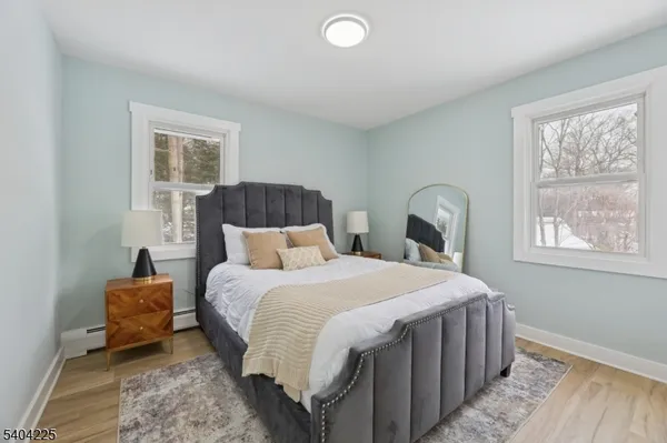 a bedroom with bed and a window