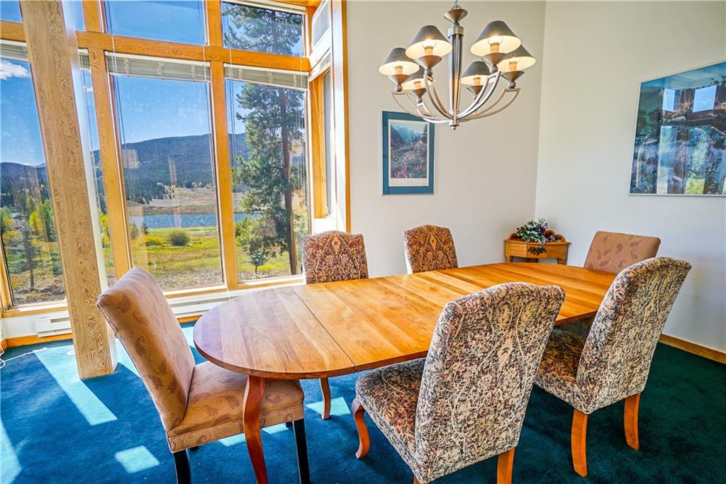 63 Saxifrage Road Keystone, CO 80435 - Photo 2 of 25 a dining room with furniture and wooden floor