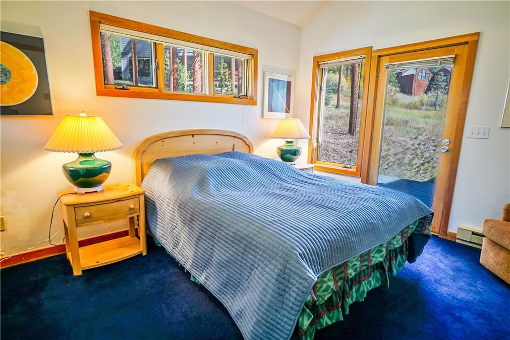 63 Saxifrage Road Keystone, CO 80435 - Photo 22 of 25 a bedroom with a bed and wooden floor