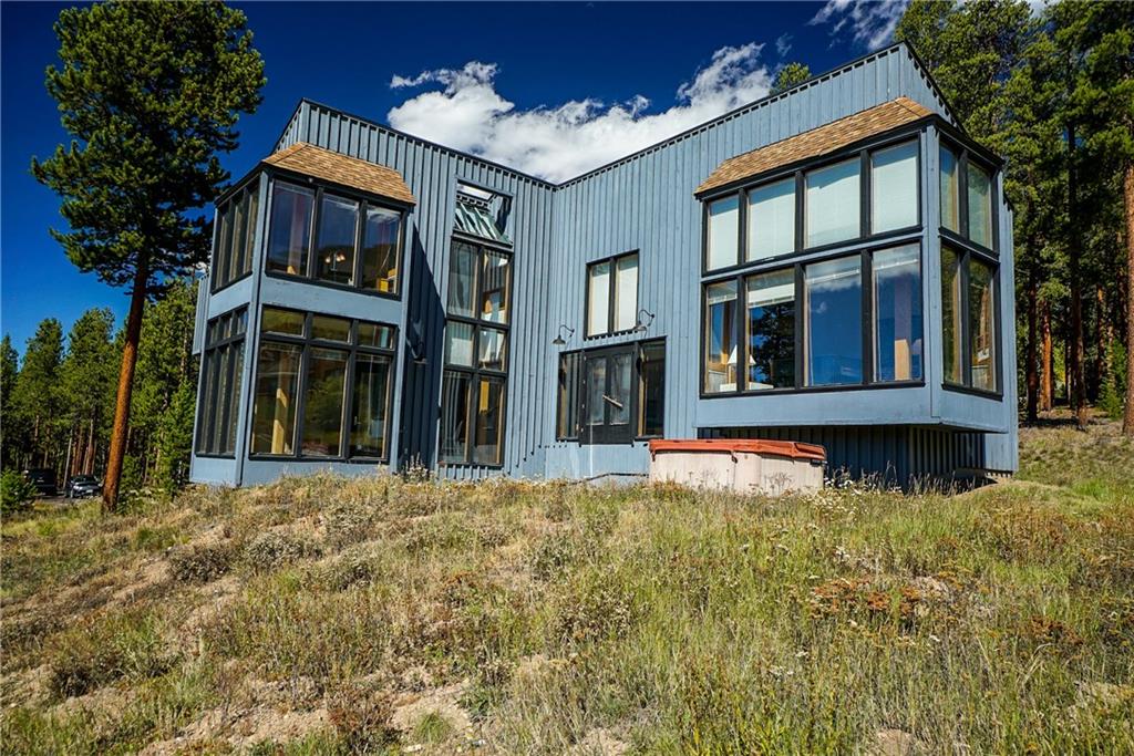 63 Saxifrage Road Keystone, CO 80435 - Photo 23 of 25 a view of a house with large windows and a small yard
