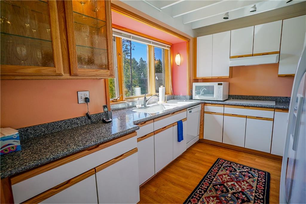 63 Saxifrage Road Keystone, CO 80435 - Photo 7 of 25 a kitchen with granite countertop stainless steel appliances a sink and cabinets