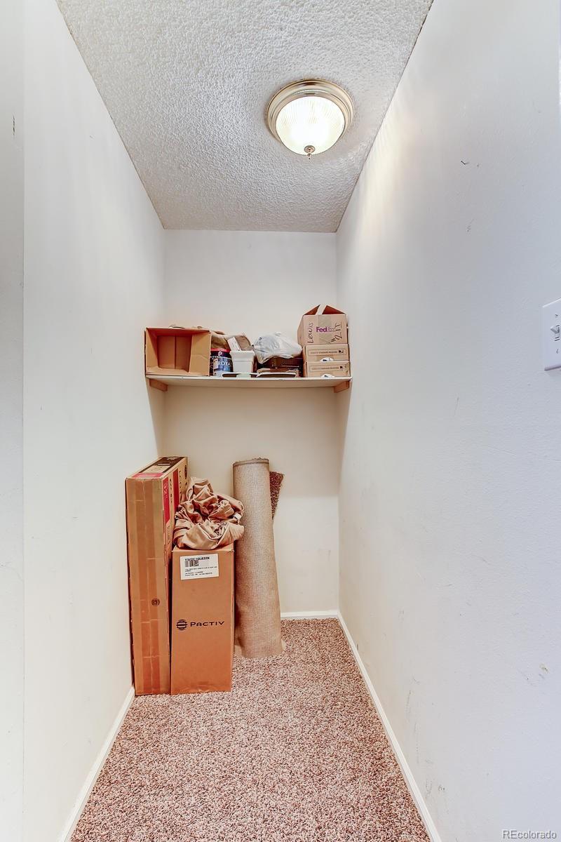 1020 15th Street, Unit 21I Denver, CO 80202 - Photo 10 of 27 a bedroom with a bed and cabinets