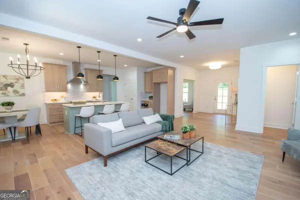 a living room with furniture and a flat screen tv