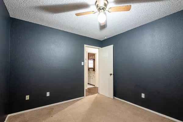 a view of a hallway with a chandelier