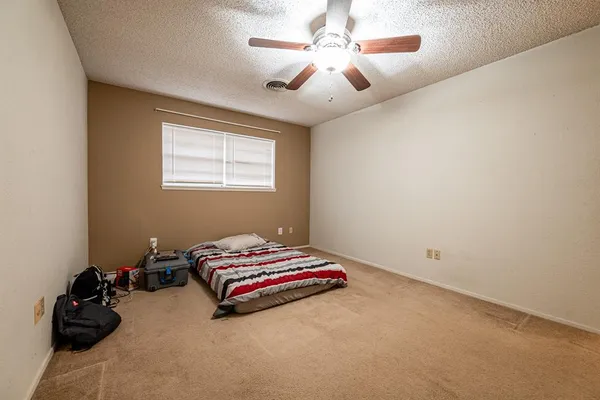 a room with gym equipment and a window