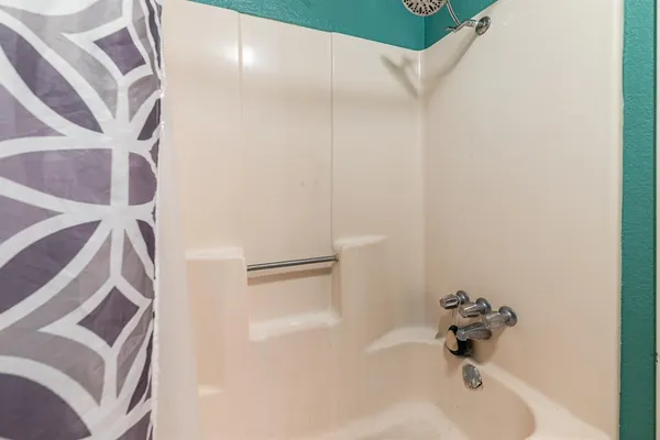 a bathroom with a white tub