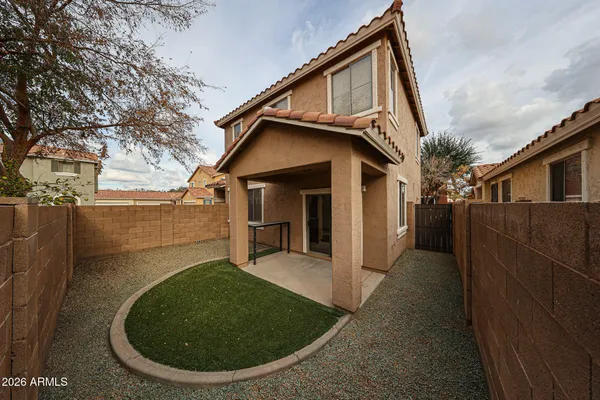 a view of a house with a small yard