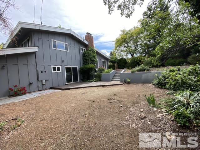 945 West 12th Street Reno, NV 89503 - Photo 24 of 29 a backyard of a house with a yard and garage